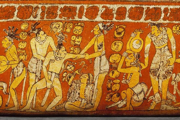 Mayan art showing inebriated person being helped