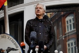 Julian Assange delivers a speech on the balcony of the Ecuadorian Embassy in London.