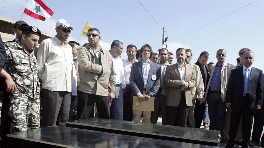 Hezbollah members with coffins believed to contain the bodies of Ehud Goldwasser and Eldad Regev.