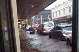 Flash Flooding surrounds cars at Camberwell Junction