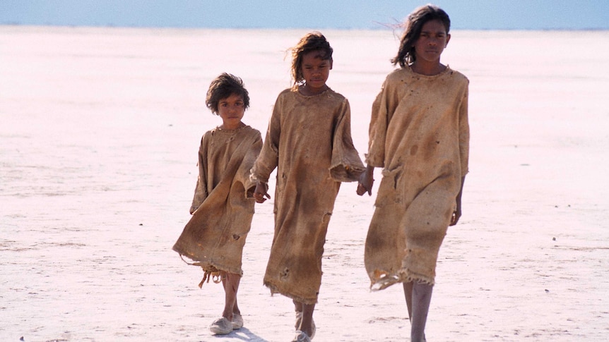 Tianna Sansbury, Laura Monaghan and Everlyn Sampi as Daisy, Gracie and Molly traversing a salt pay by Matt Nettheim