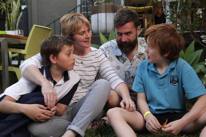 Jo Dean with her family in the backyard