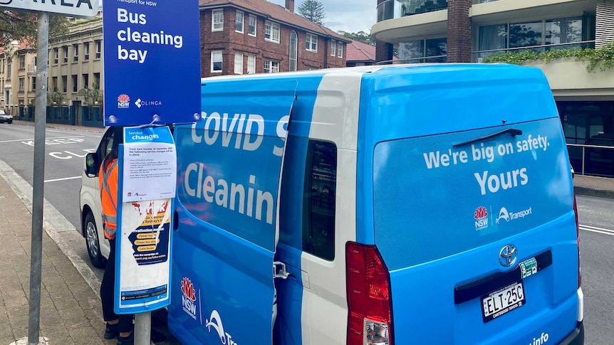 A sign and a van at a bus-cleaning bay at Sydney.