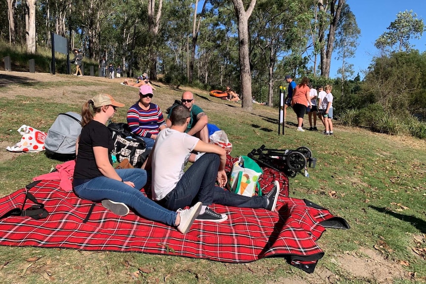 Walkers and picnic groups at Enoggera Reservoir at Brisbane State Forest.