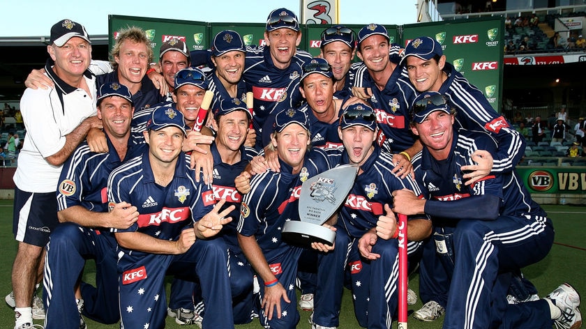 The Victorian Bushrangers pose with their domestic Twenty20 trophy after beating the Warriors