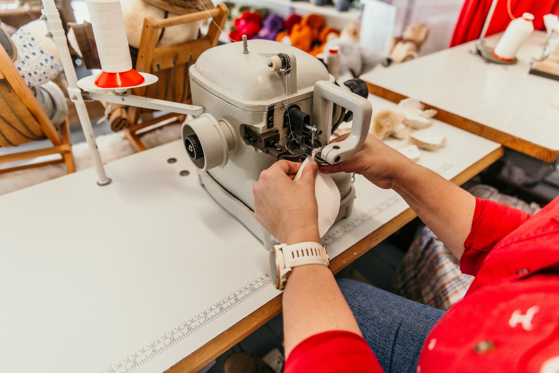a small sewing machine being operated