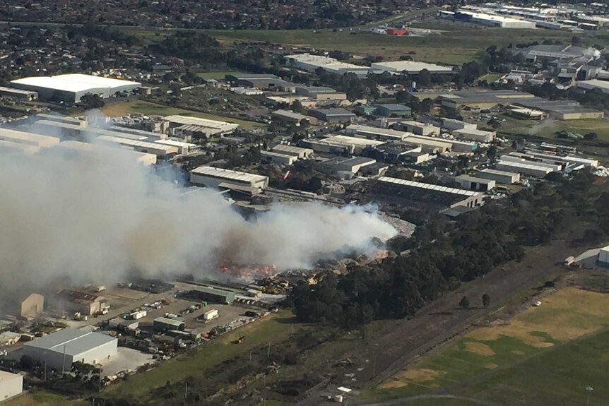 A huge plume of smoke from a fire at a Coolaroo recycling plant.