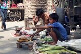 Shahabuddin sells corn on the street