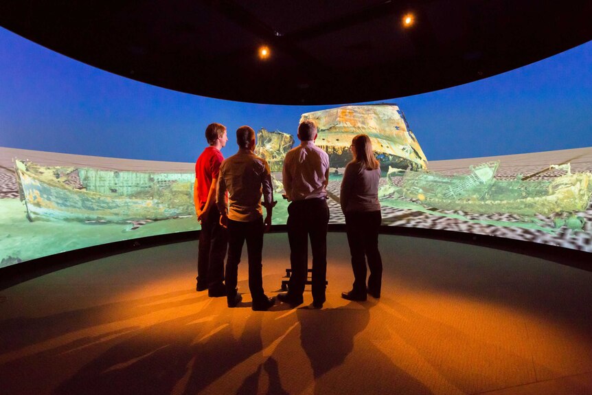 Sydney-Kormoran Project team members view 3D reconstructed models of HMAS Sydney II at the Curtin University HIVE.