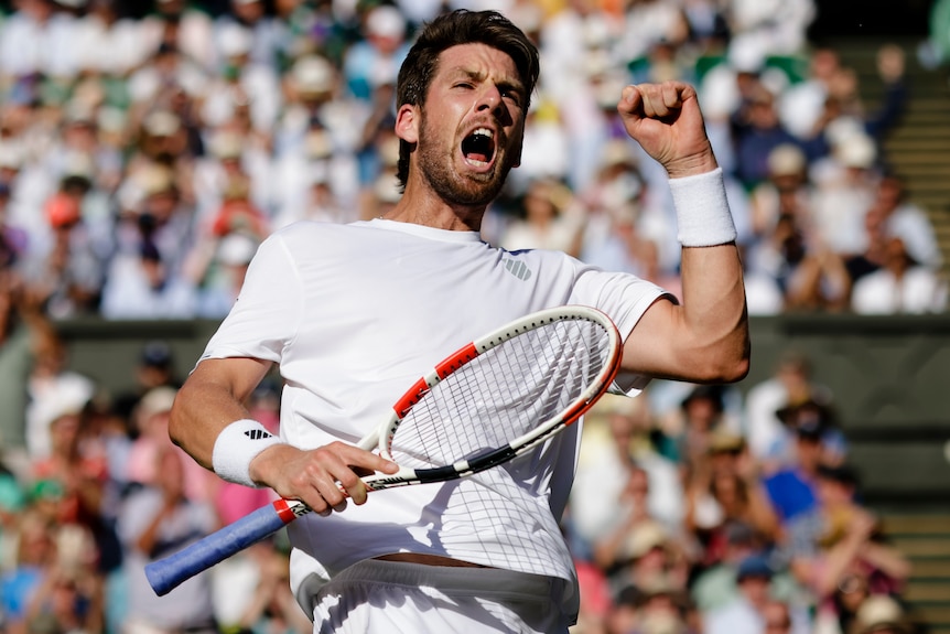 Cameron Norrie pumps his fist and cheers.