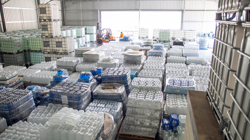 Supplies of donated drinking water at a warehouse in Stanthorpe.