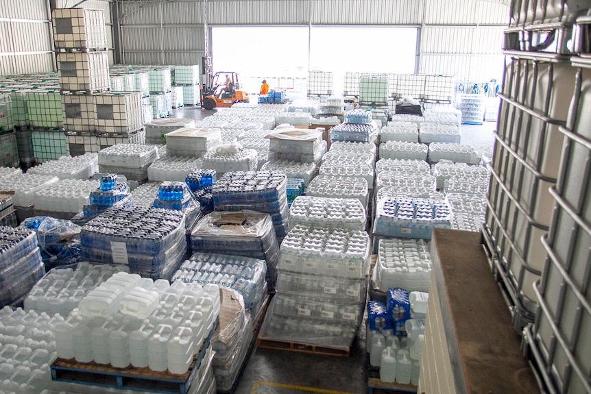 Supplies of donated drinking water at a warehouse in Stanthorpe.