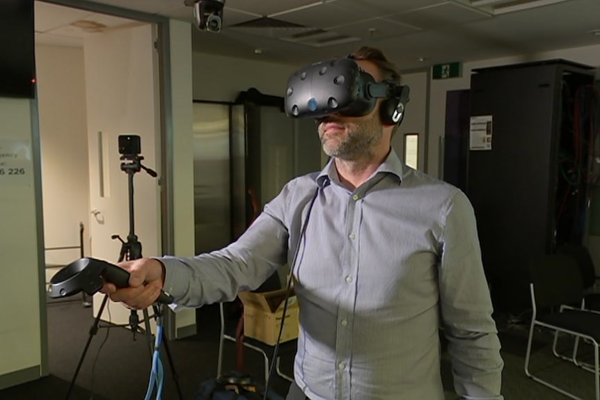 A man wears a virtual reality headset.