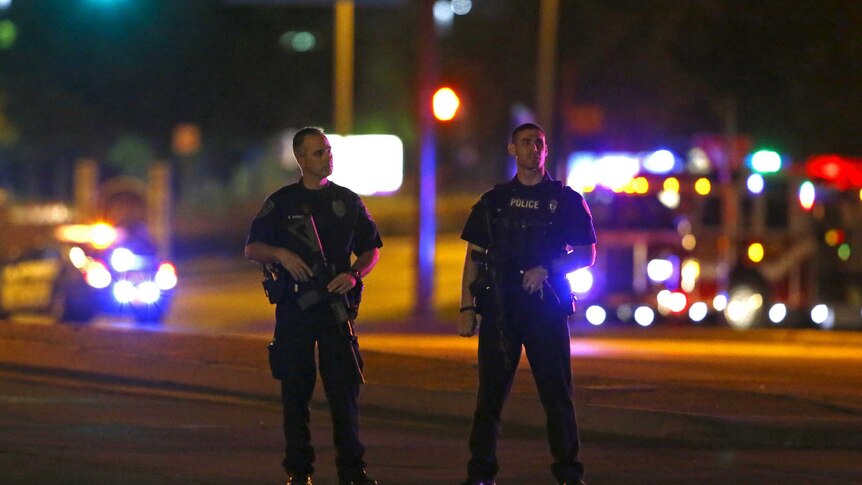 Police officers block intersection after shooting at the Muhammad Art Exhibit and Contest in Texas