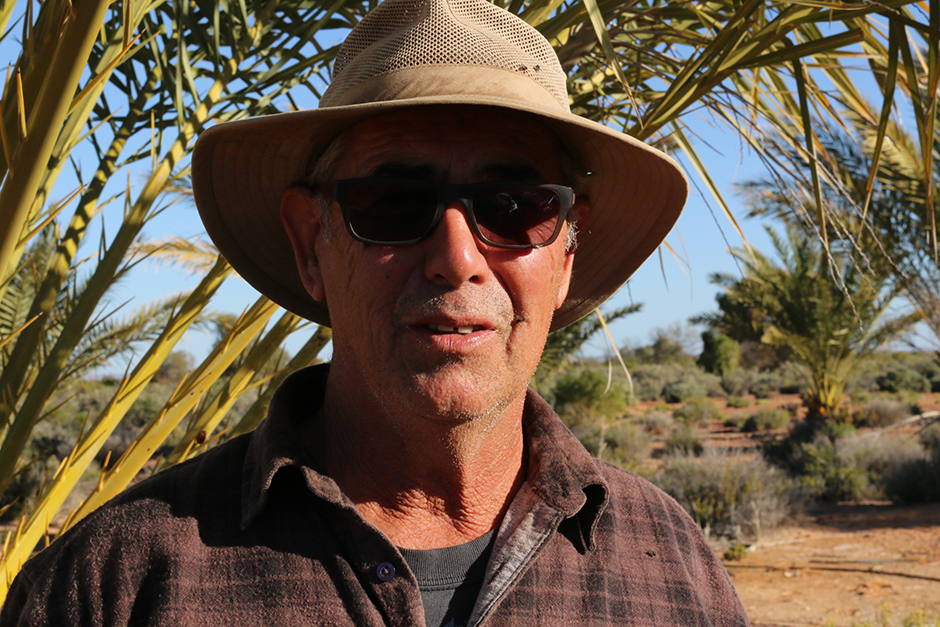 A man in a broadbrimmed hat and sunglasses