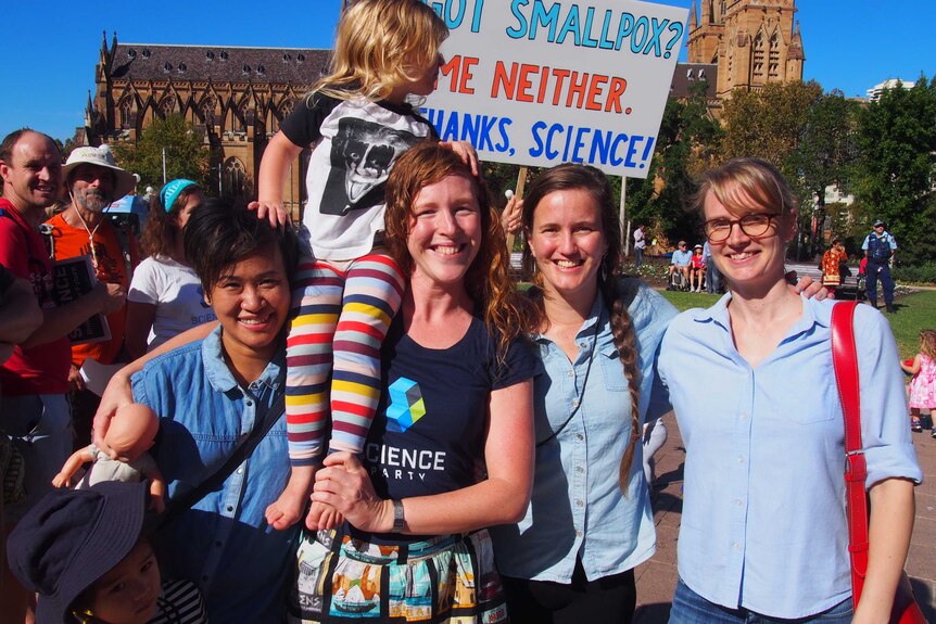 Jenny, Ruth, Myra and Catherine stand together at the march in Sydney's hyde park