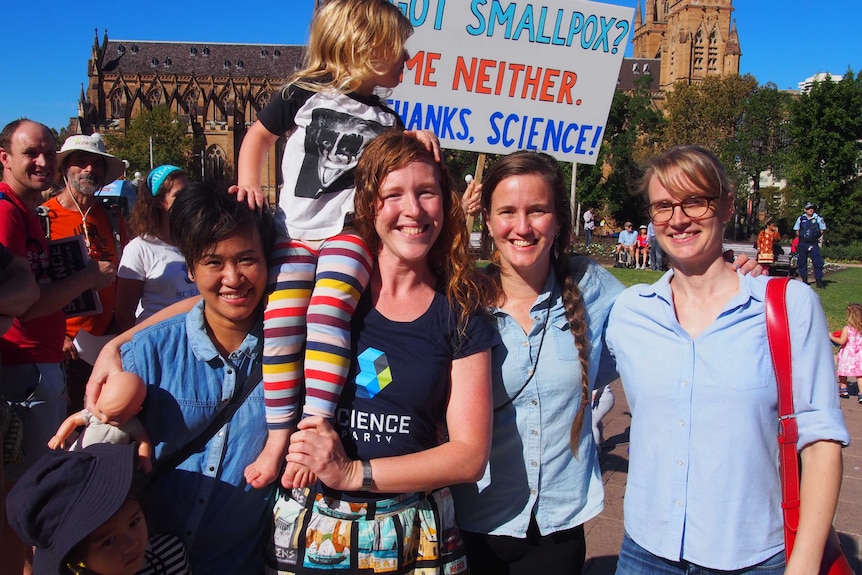 Jenny, Ruth, Myra and Catherine stand together at the march in Sydney's hyde park