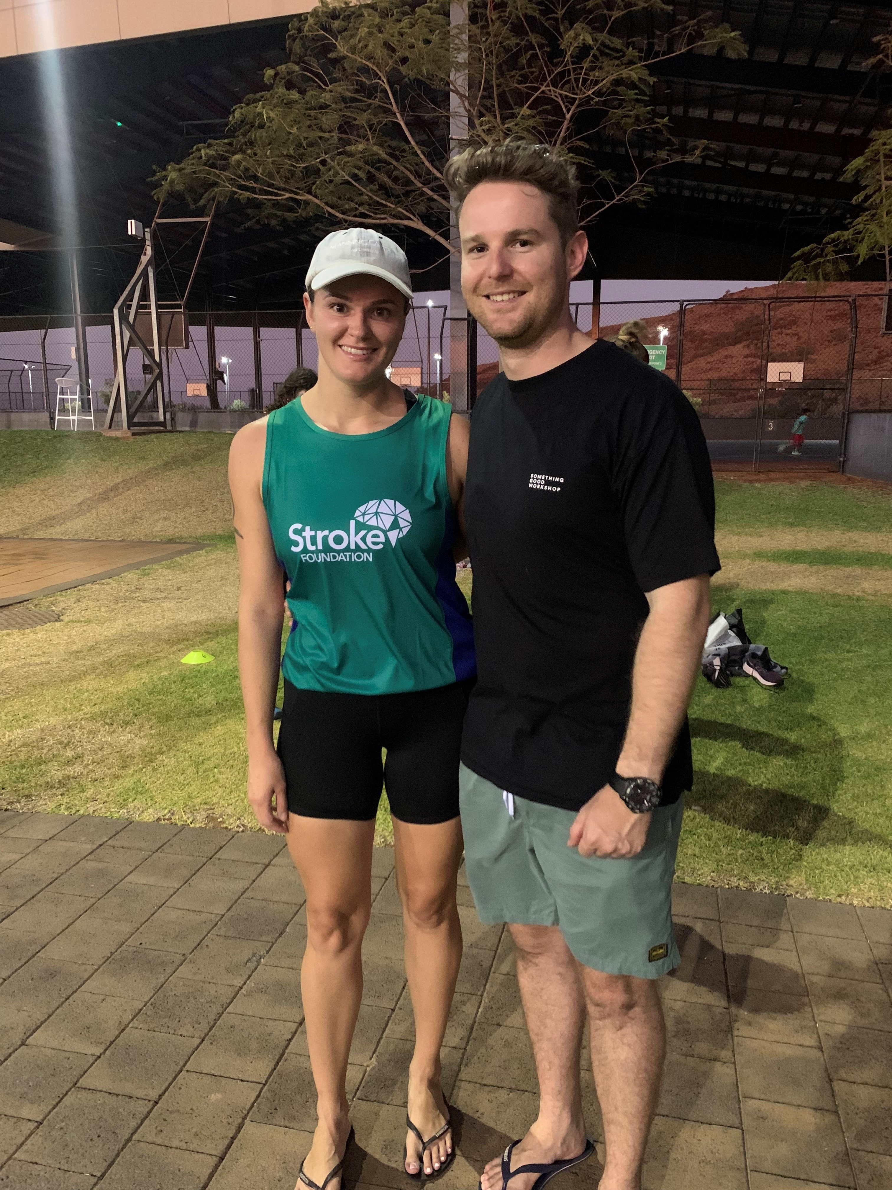 A young man and woman smiling. The woman wears a green shirt that reads &#x27;Stroke Foundation&#x27;.