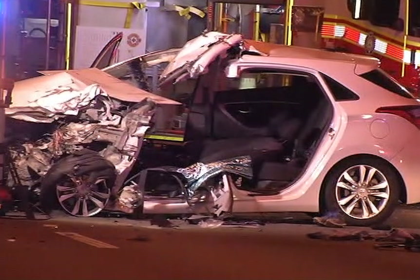 A Hyundai car smashed up after a road crash on the Gateway Motorway