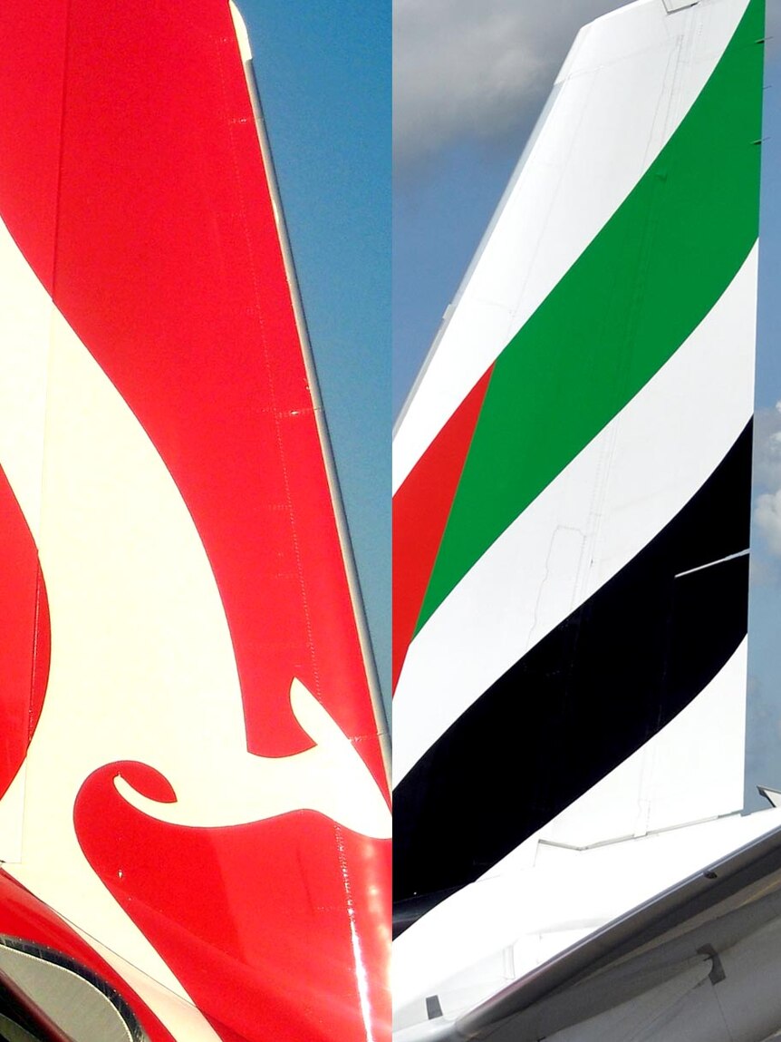 LtoR Tails of a Qantas and Emirates plane.