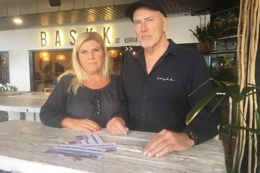Donna and Steve Donna Archdeacon stand at a bench at their Baskk restaurant at Kirra.