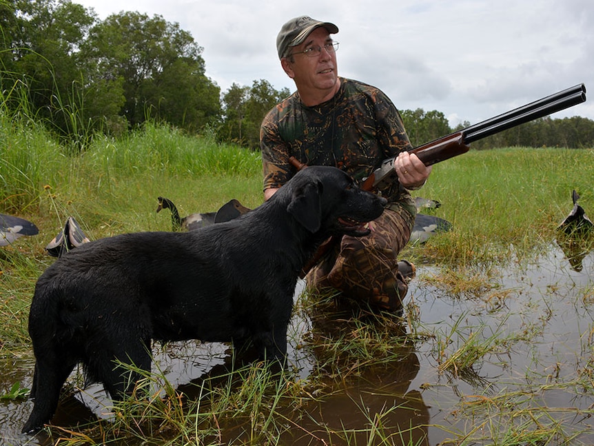NT Field and Game Association President Bart Irwin with his dog Daisy and decoy geese.