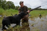 NT Field and Game Association President Bart Irwin with his dog Daisy and decoy geese.