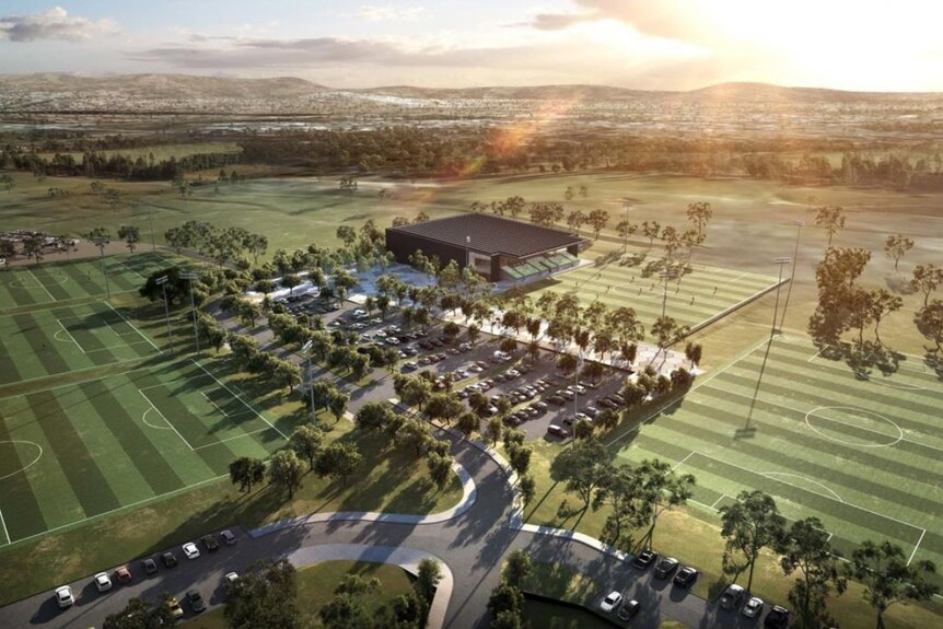 An artist's impression of a number of buildings surrounded by soccer fields.