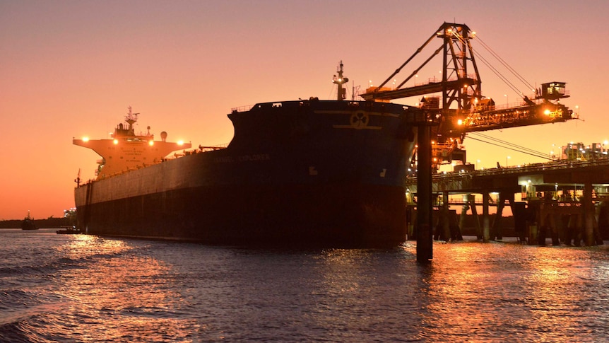 The first iron ore from the Roy Hill mine being loaded on to a ship at Port Hedland.