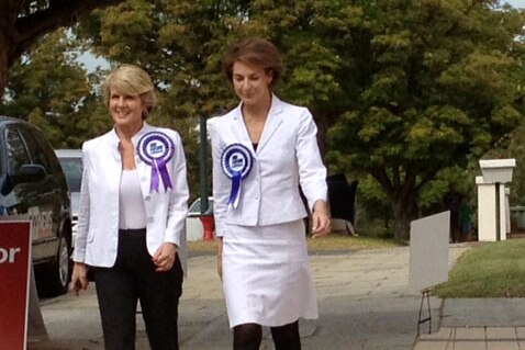 Liberal Senator Michaelia Cash and Deputy Leader Julie Bishop walk together towards a polling station in Wembley this morning.