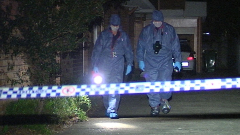 Qld police forensics officers at the Gold Coast unit where Daniel Dwyer was found dead on August 8, 2008.