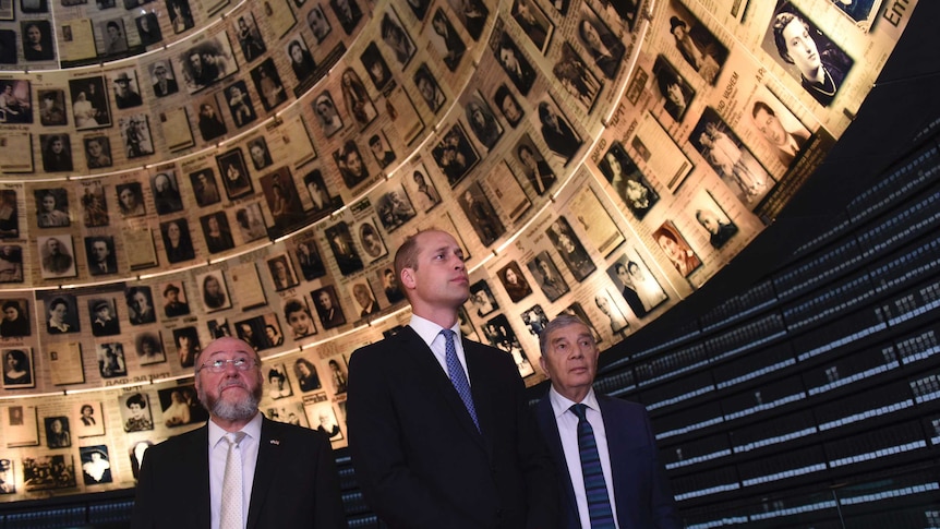 Prince William, centre, visits the Hall of Names at the Yad Vashem Holocaust Memorial, in Jerusalem.