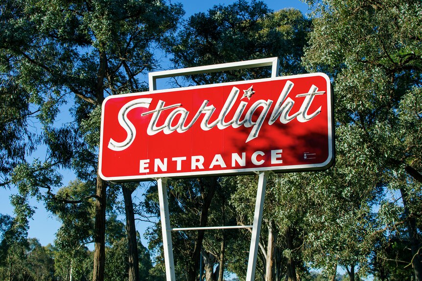 Large sign at entrance of Starlight drive in