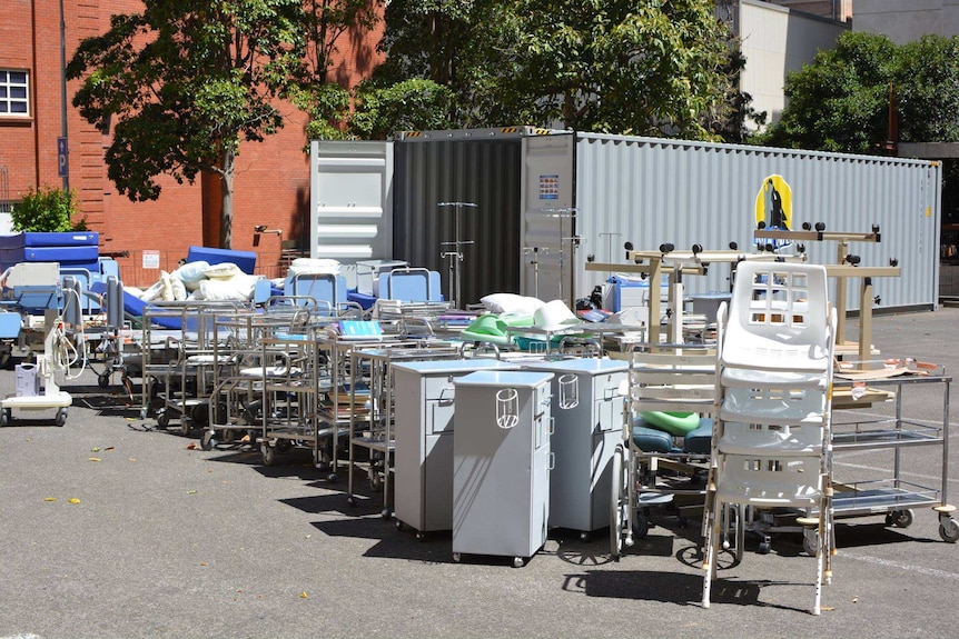 Medical equipment from the old Royal Adelaide Hospital is packed into a shipping container