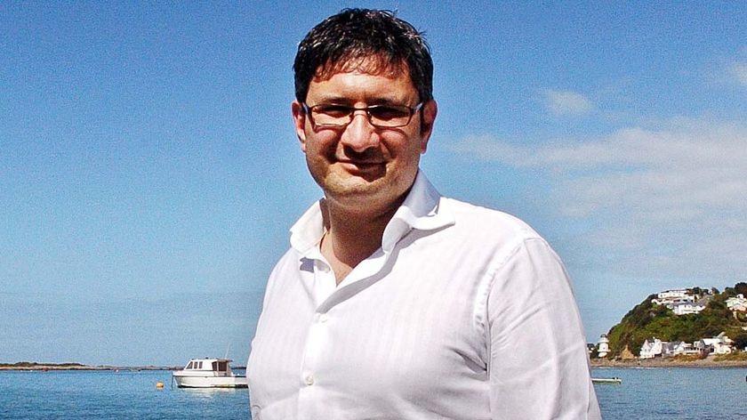 Glenn Inwood poses for a photo at Island Bay in Wellington, New Zealand