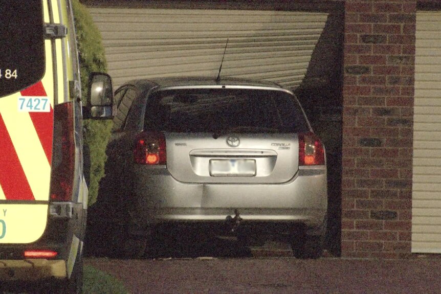 A car crashed into a garage door.