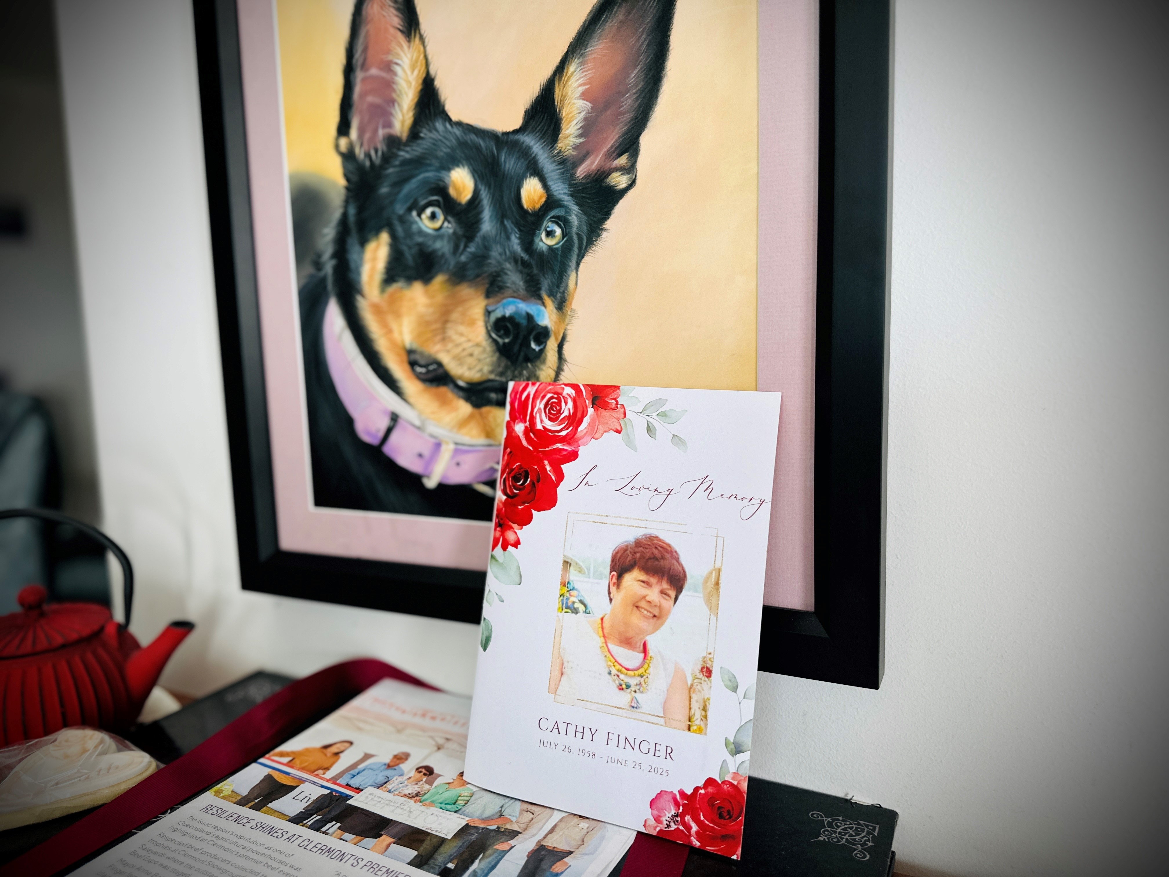 Photo tributes of a woman and a kelpie dog.
