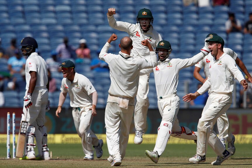Australia shows its joy after claiming victory in the first Test in Pune.