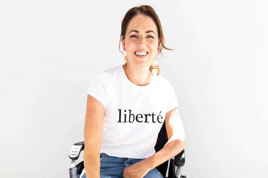 A photograph of Jenny McAllister wearing a t-shirt which reads 'liberte'.