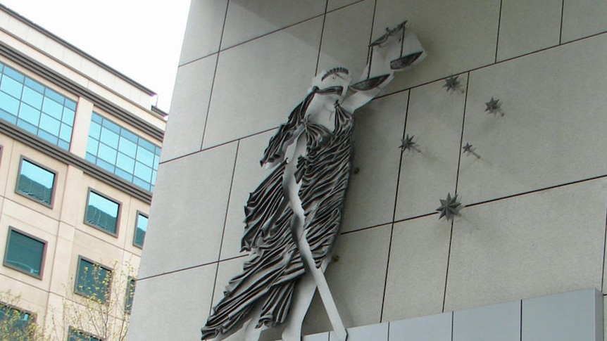 the county court logo on the facade of a building