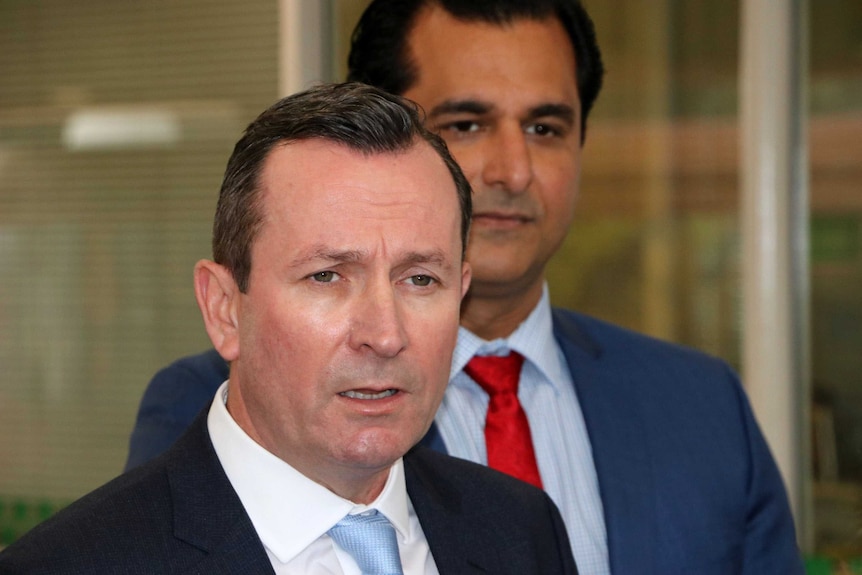 Close-up of WA Premier Mark McGowan with Member for Jandakot Yaz Mubarakai standing behind him.