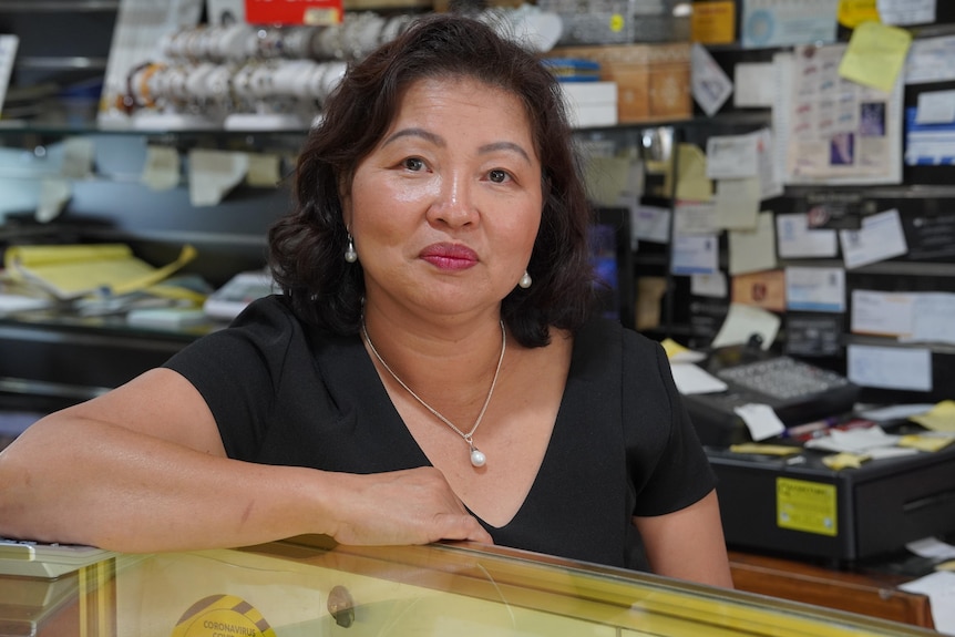 A photo of Seak Ay in her shop at work.