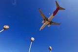 The underside of a Qantas plane flying over Adelaide