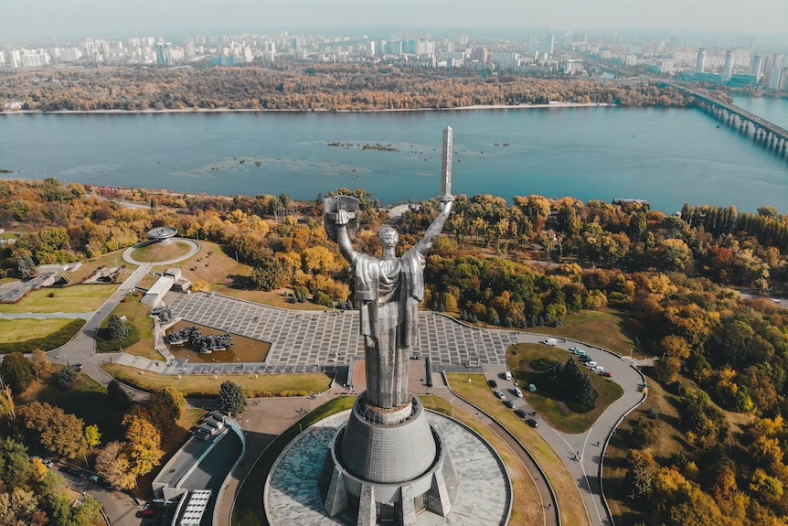 An aerial view of Motherland Monument and view of city and of Kyiv