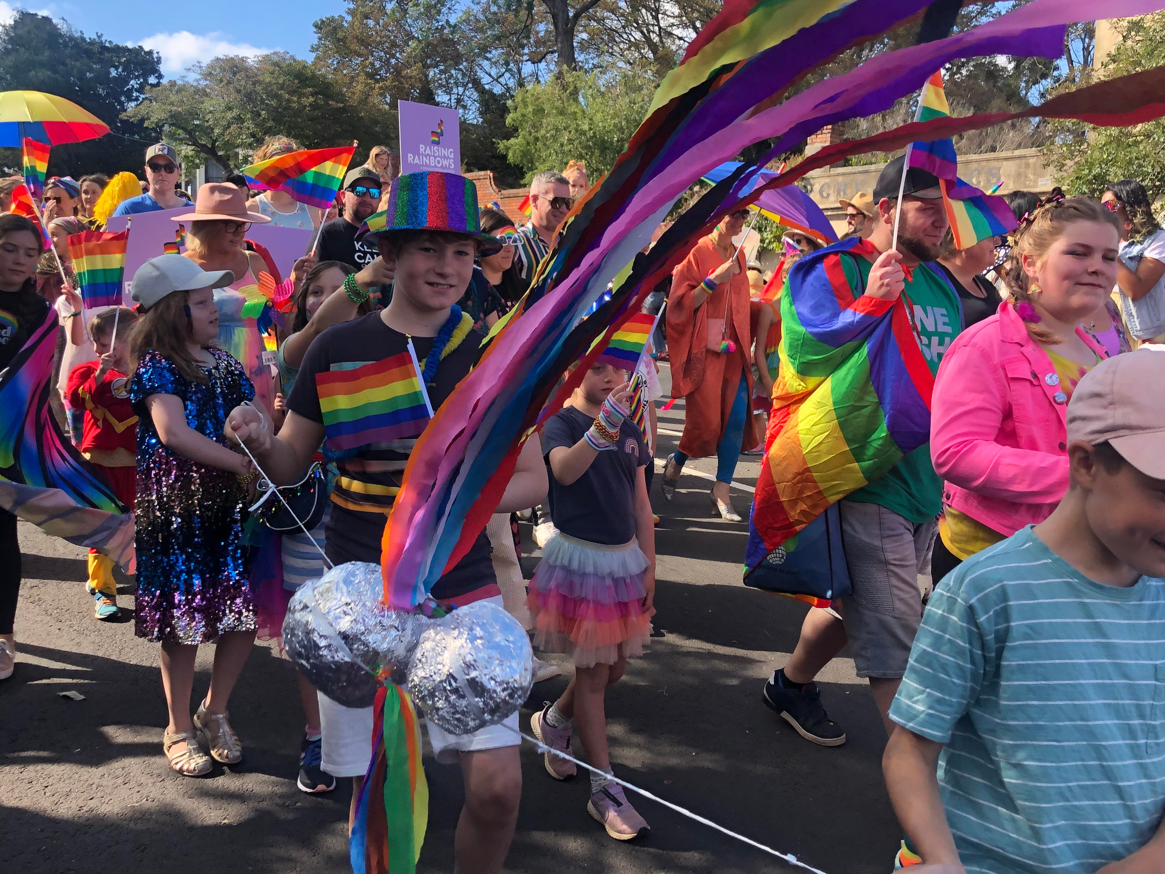 Rainbows everywhere amongst dozens of children