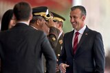 An army officer salutes Venezuela's Vice-President Tareck El Aissami.