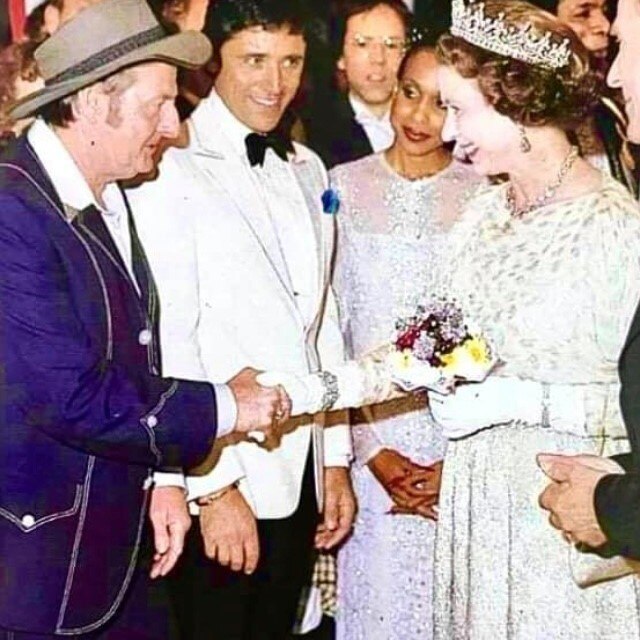 Slim Dusty shaking hands with Queen Elizabeth II