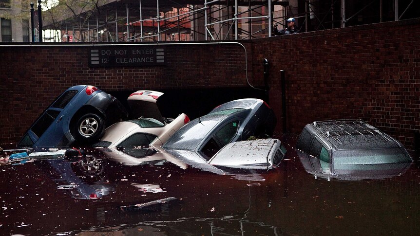 Cars are submerged in a New York basement