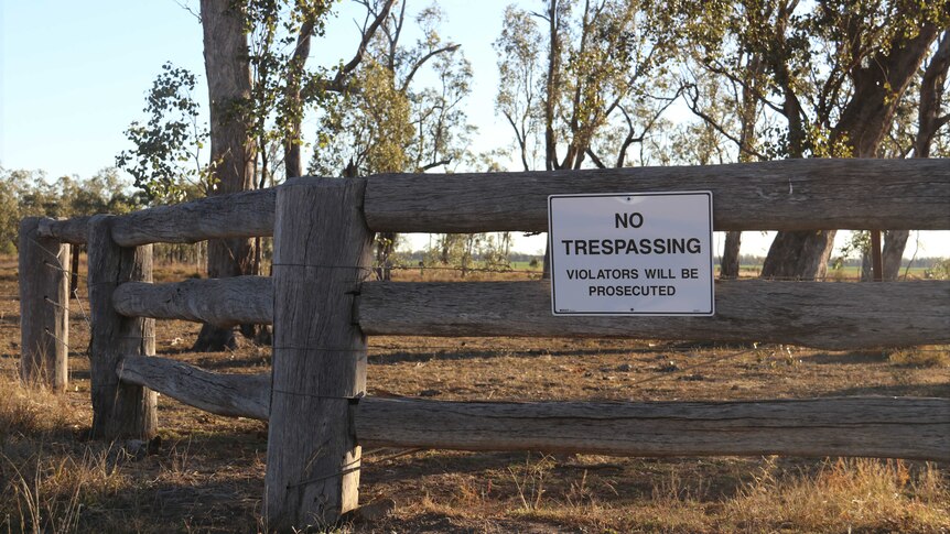 A "no trespassing" sign located on the fence at the entrance of Lemontree Feedlot.