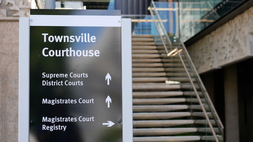 Sign in front of a building and stairs says Townsville Courthouse